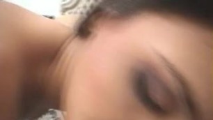 Slutty blonde with curly hair is masturbating her dick on the sofa