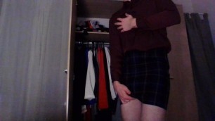 Crossdresser in a sexy tartan secretary skirt and silk shirt