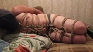 Struggle in tight hogtie bondage