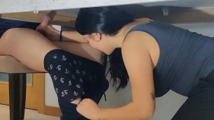 Milf pleasures son's friend with a handjob under the table